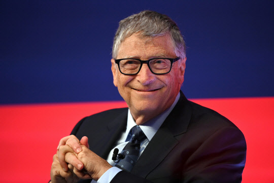FILE PHOTO: Bill Gates reacts during the Global Investment Summit at the Science Museum, in London, Britain, October 19, 2021. Leon Neal/Pool via REUTERS/File Photo